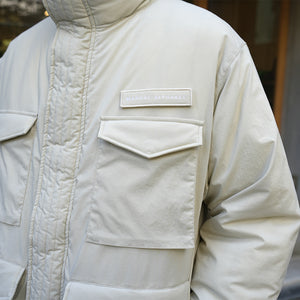 MANUAL ALPHABET×NANGA  FIELD DOWN JACKET